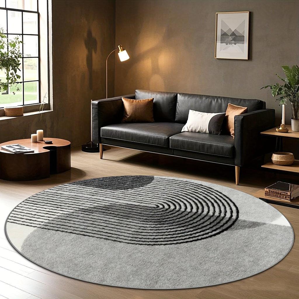 Grand tapis rond gris et noir à arcs concentriques en relief