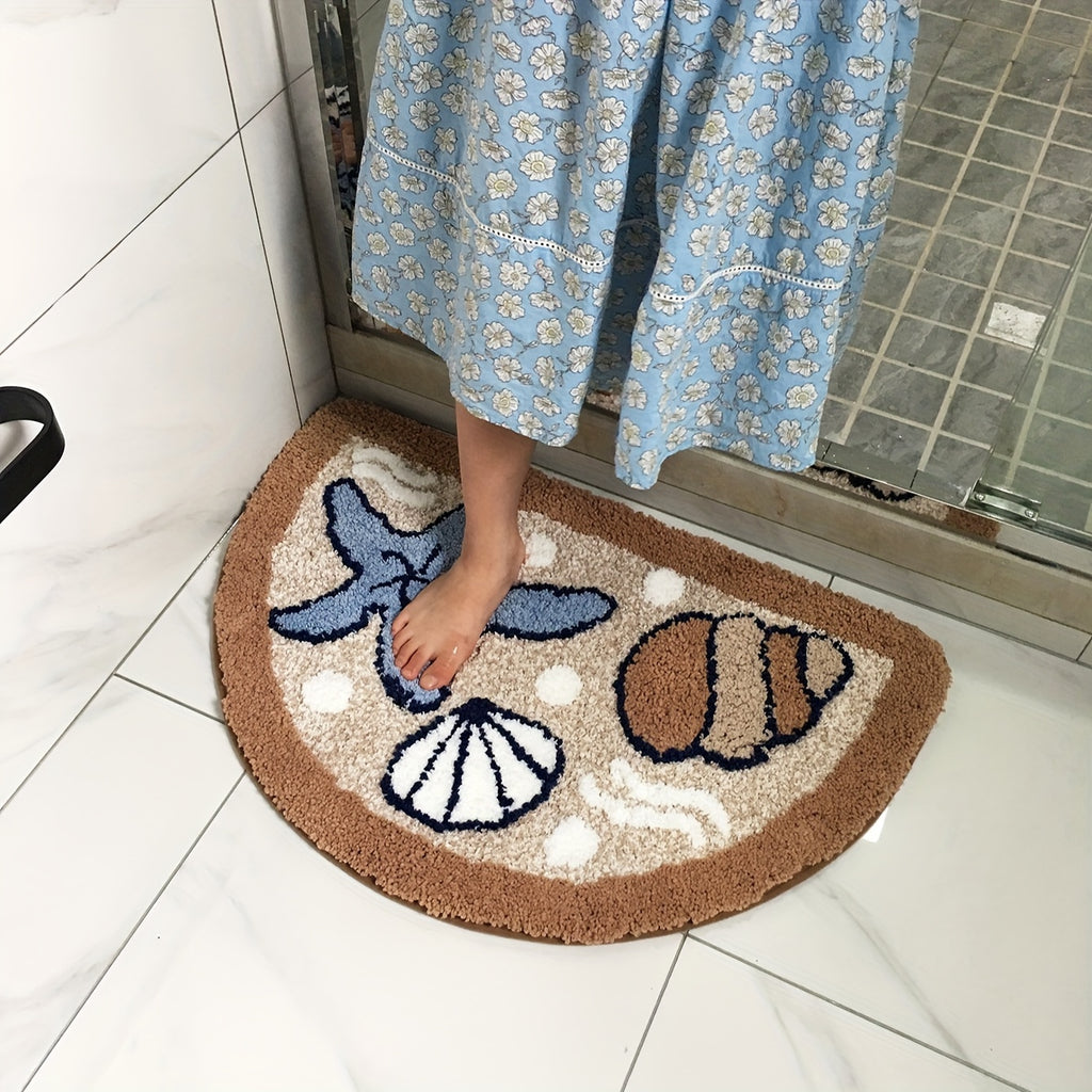 Tapis de bain demi-lune touffeté à coquillages, 45 x 70 cm