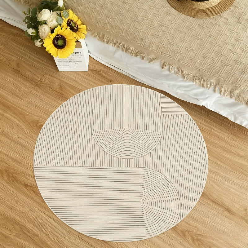 Tapis rond crème de 110 cm strié façon jardin sec japonais