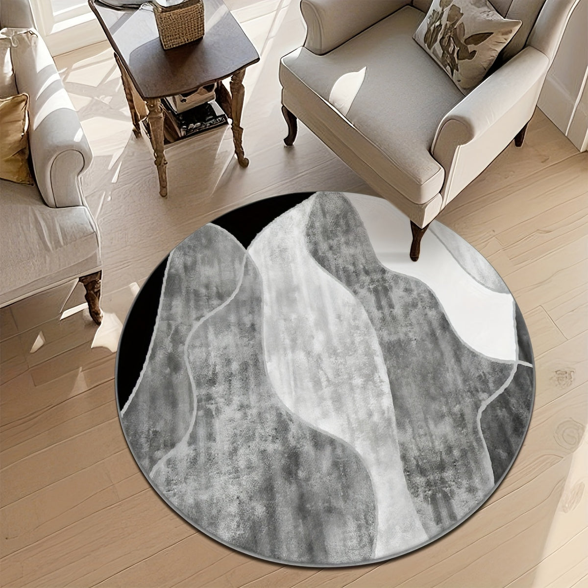 Tapis rond gris et blanc à bandes courbes, avec liseré noir