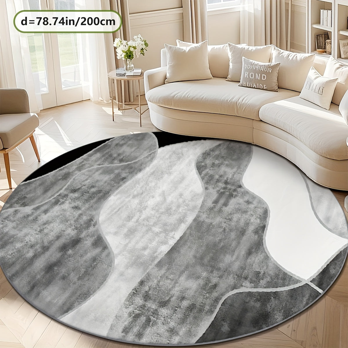 Tapis rond gris et blanc à bandes courbes, avec liseré noir