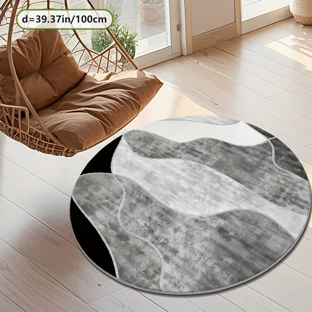 Tapis rond gris et blanc à bandes courbes, avec liseré noir