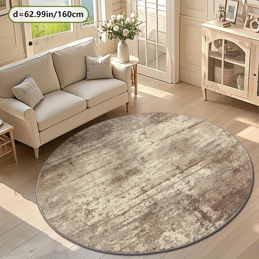 Tapis rond beige à effet vieilli, allure de tapis ancien