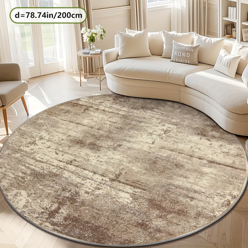 Tapis rond beige à effet vieilli, allure de tapis ancien