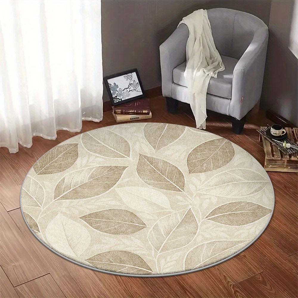 Tapis rond beige, feuillage nervuré et dos moucheté noir