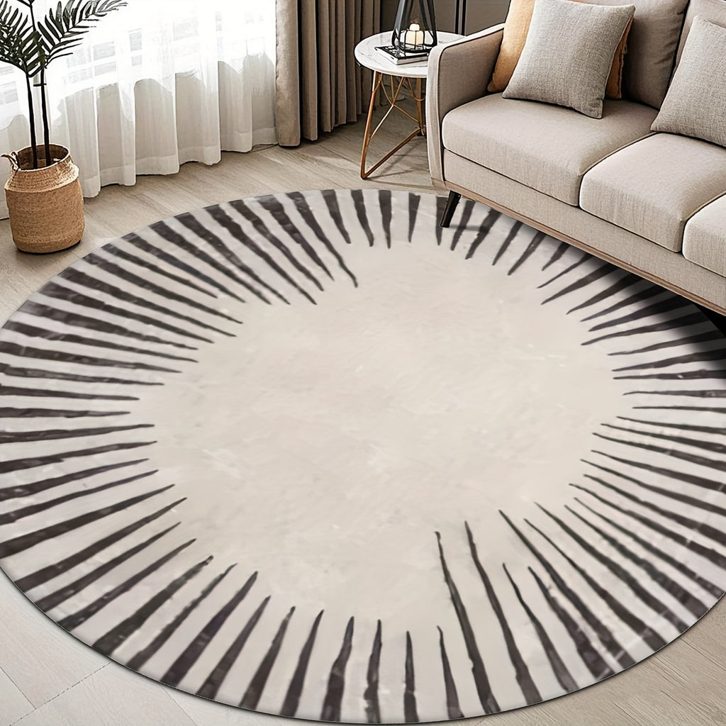 Tapis rond écru et noir à soleil tracé au pinceau, tissu plat