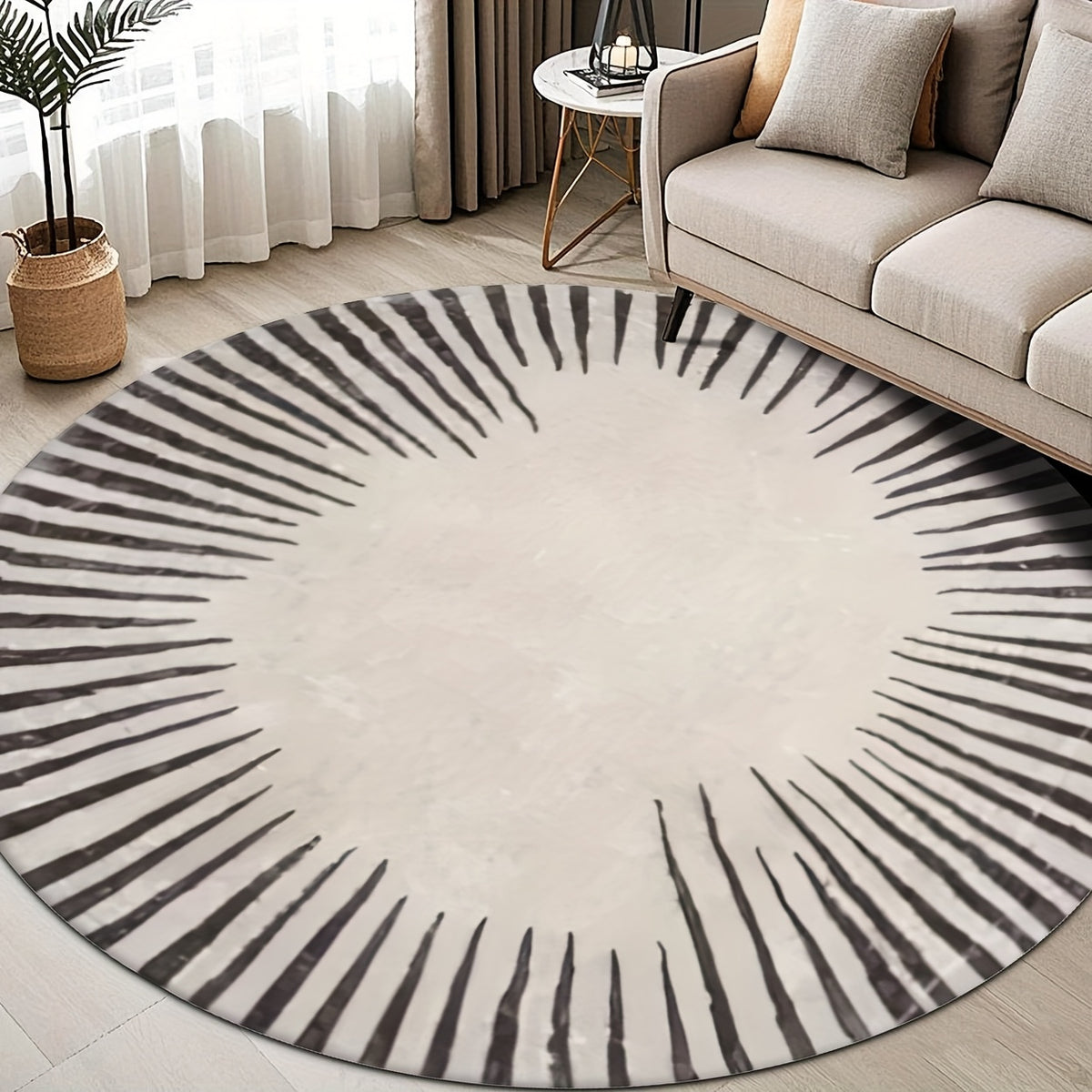 Tapis rond écru et noir à soleil tracé au pinceau, tissu plat