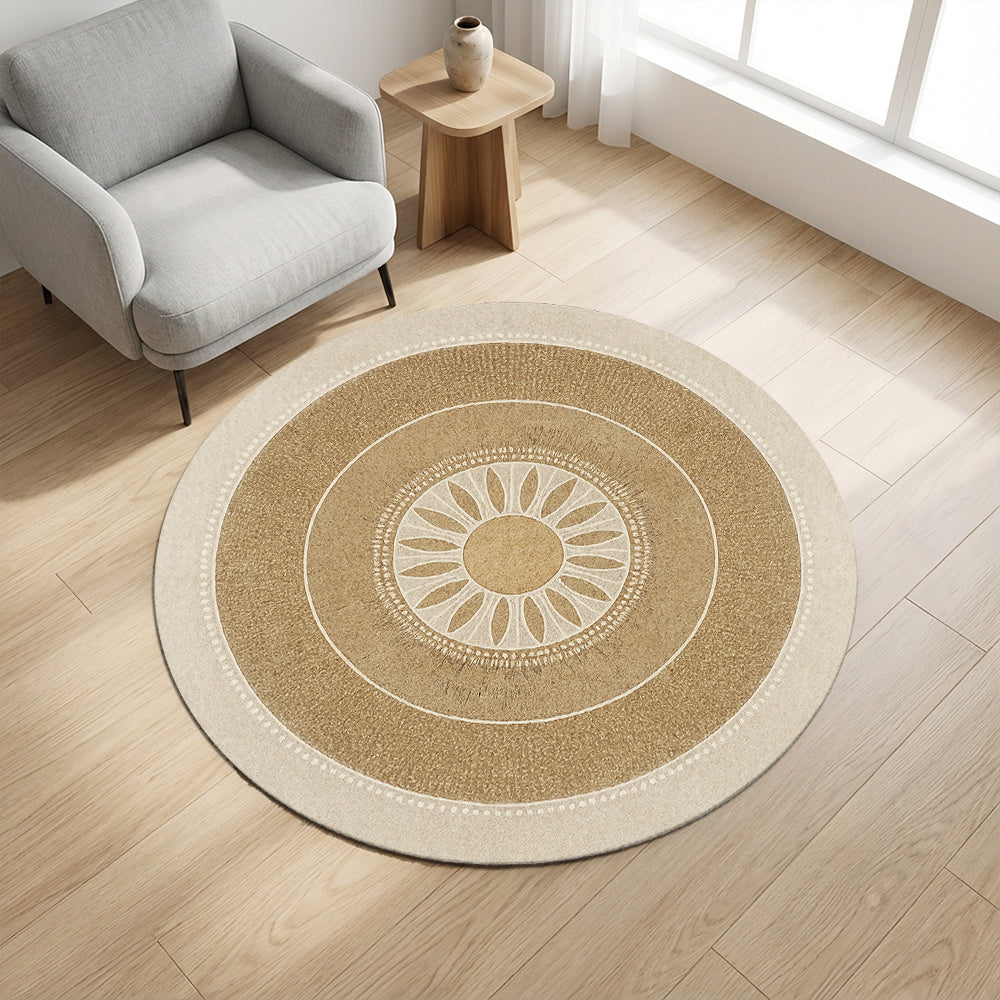 Tapis rond beige à médaillon solaire, bordure crème perlée
