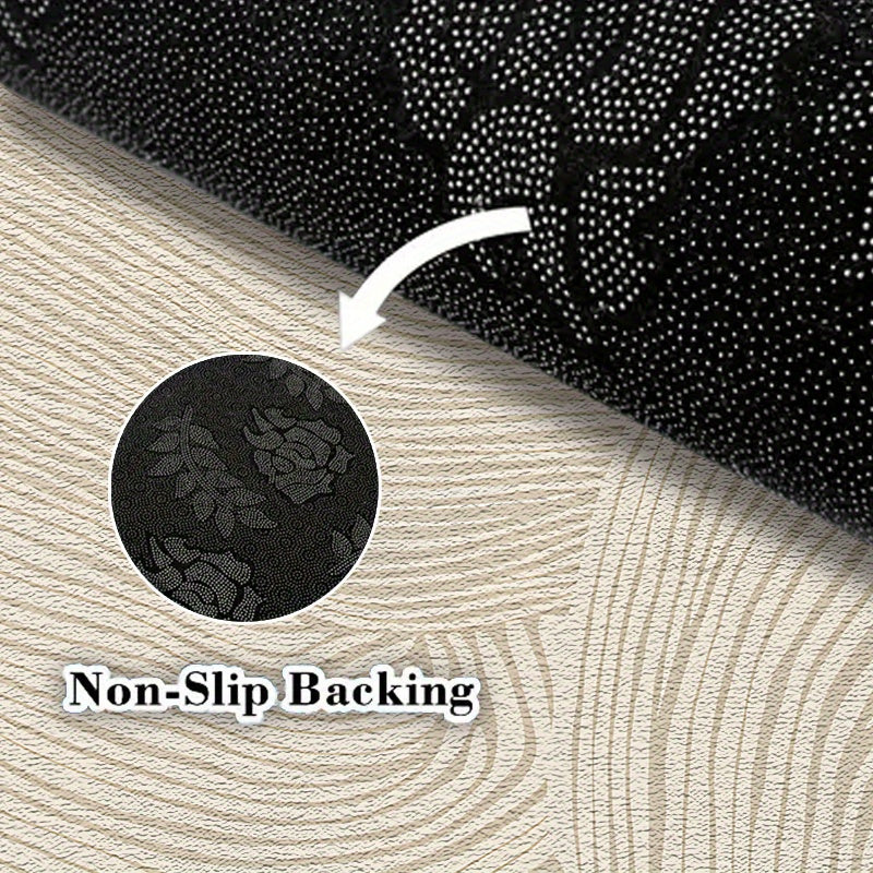 Tapis rond beige à grandes courbes sculptées dans le velours