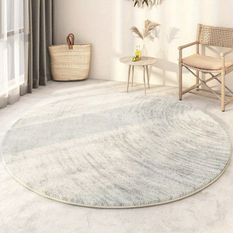 Tapis rond bleu délavé ou greige à effet de fresque usée