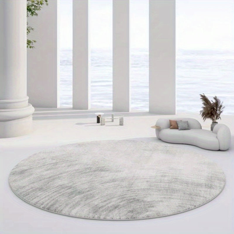 Tapis rond bleu délavé ou greige à effet de fresque usée