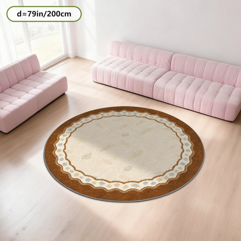 Tapis rond crème à large bord festonné brun, semis de brins