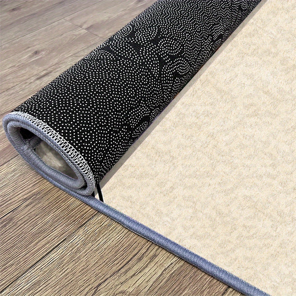Tapis rond crème à large bordure noire et texture aplatie