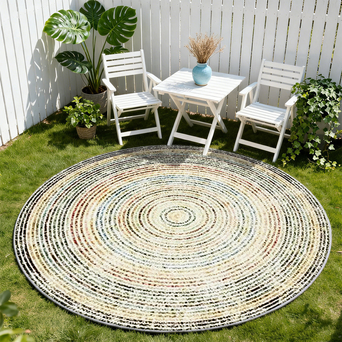 Tapis rond crème chiné à cercles mouchetés multicolores
