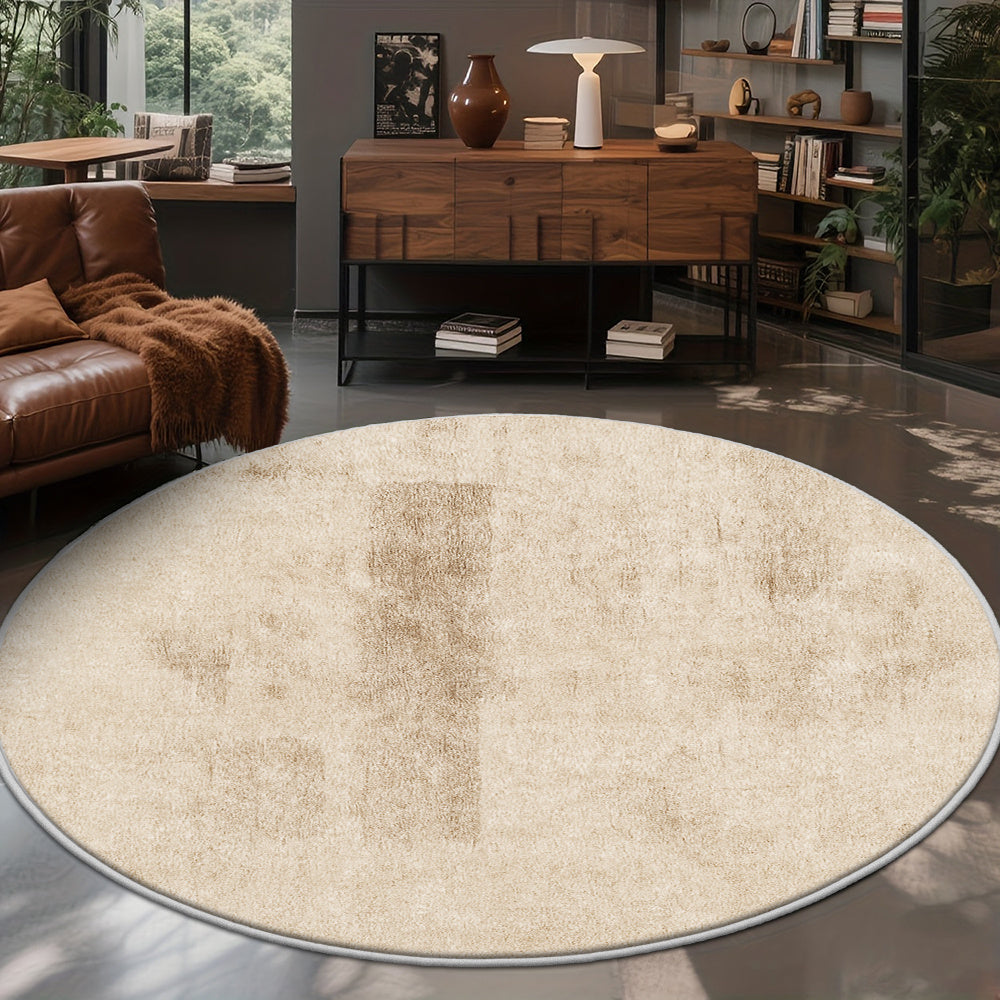 Tapis rond crème effet plâtre ciré, support à points plastiques