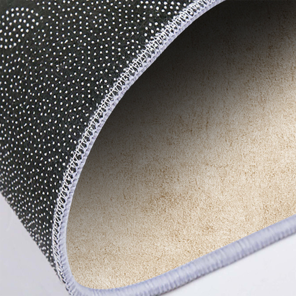 Tapis rond crème effet plâtre ciré, support à points plastiques