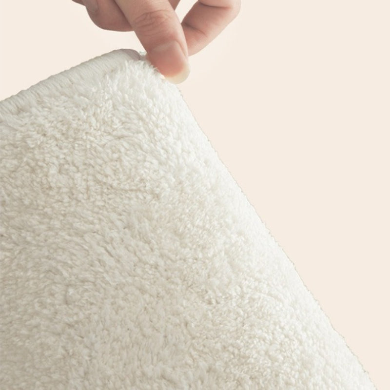 Tapis rond crème à six fleurs de cerisier roses en relief