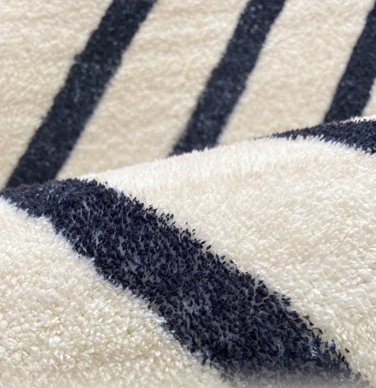 Tapis rond écru à chevrons ou à losanges noirs, 7 tailles