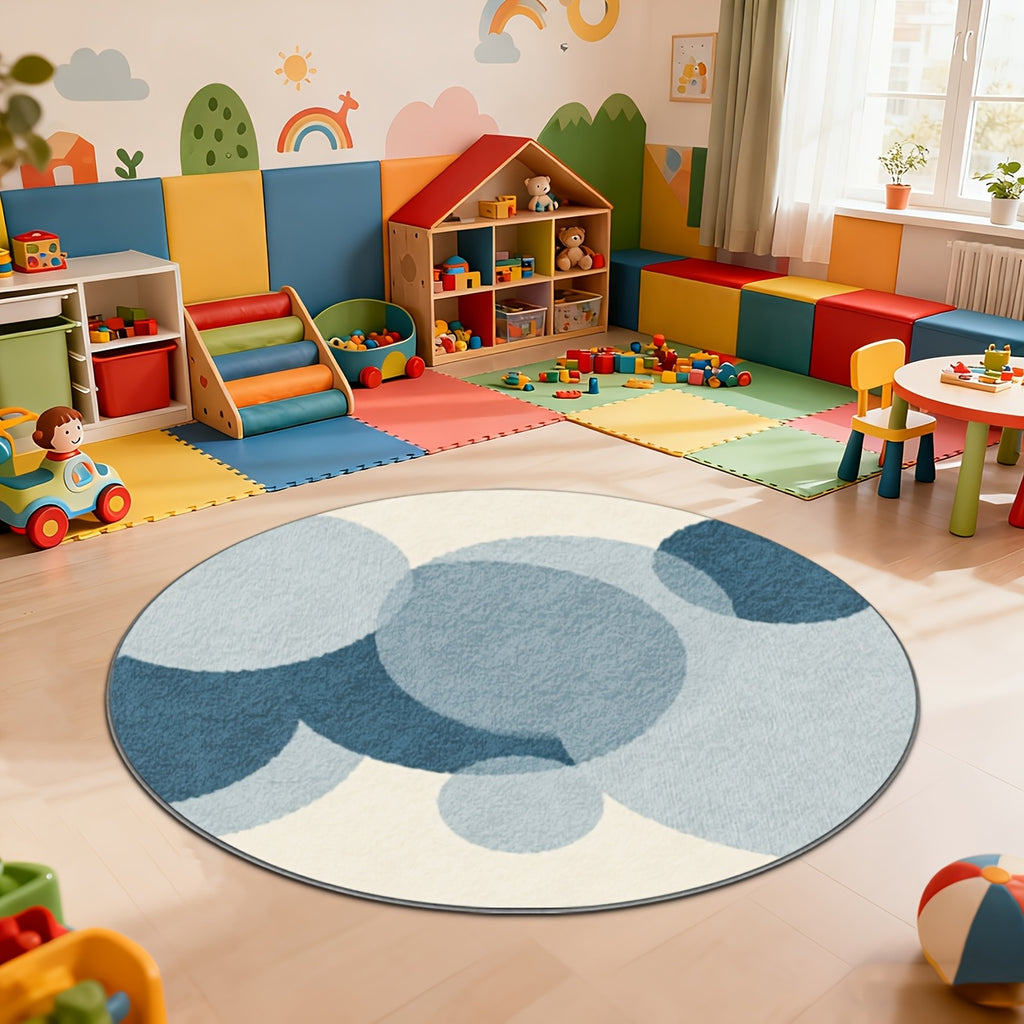 Tapis rond d'enfant à cercles bleus superposés sur crème