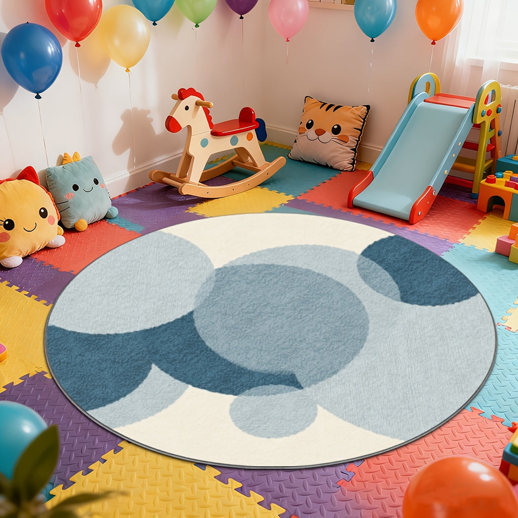 Tapis rond d'enfant à cercles bleus superposés sur crème