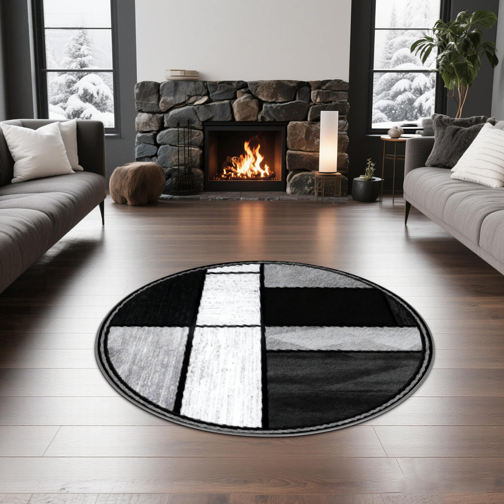 Tapis rond géométrique noir, gris et blanc, fond à pois