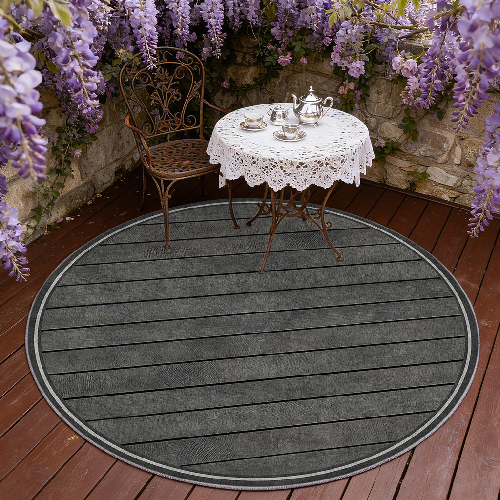 Tapis rond gris anthracite à lames de bois rayées en biais
