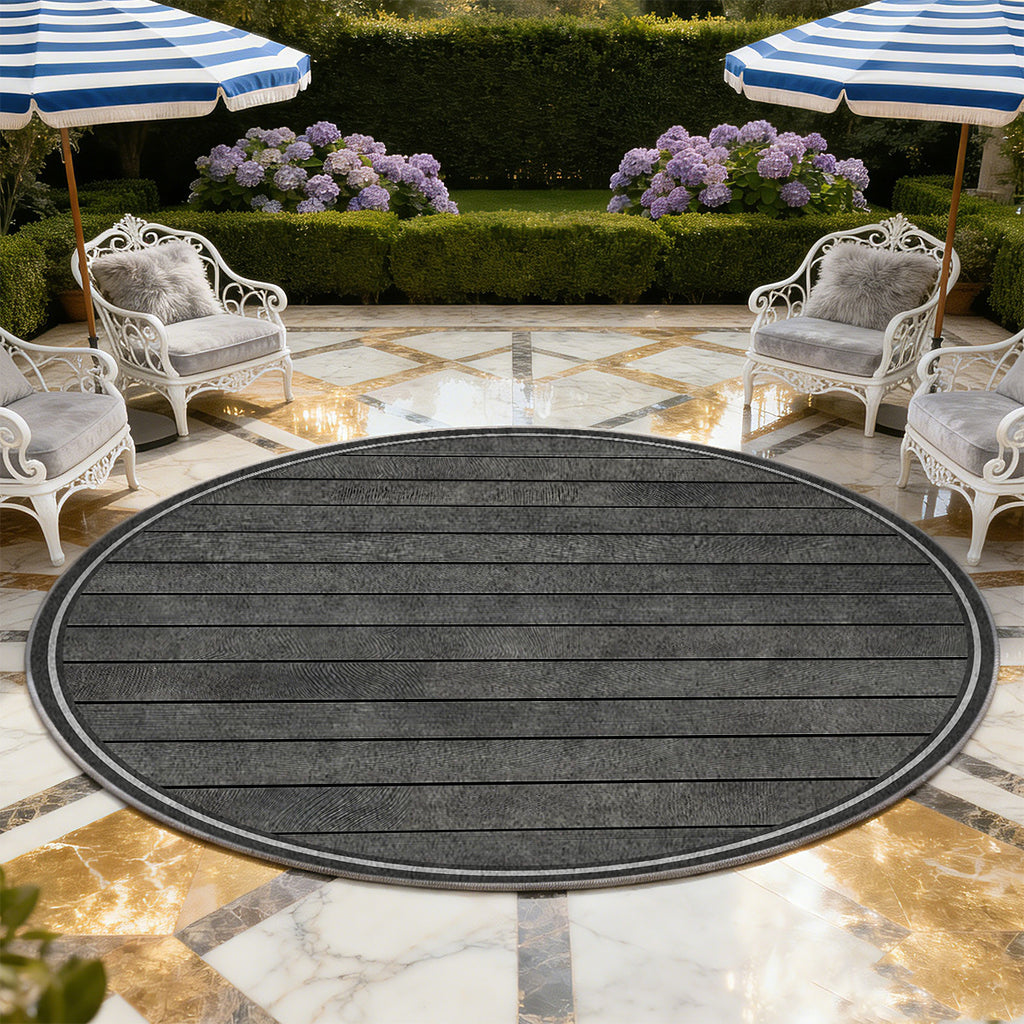 Tapis rond gris anthracite à lames de bois rayées en biais