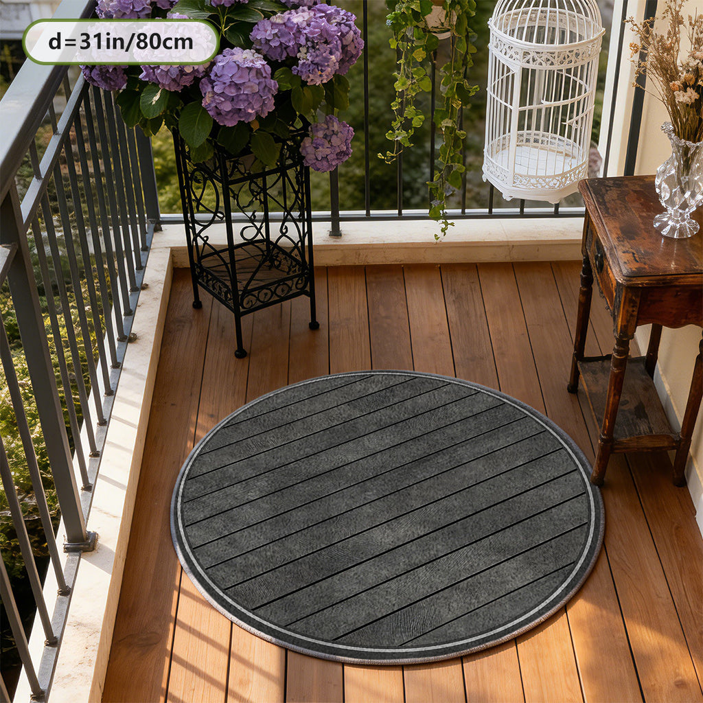Tapis rond gris anthracite à lames de bois rayées en biais