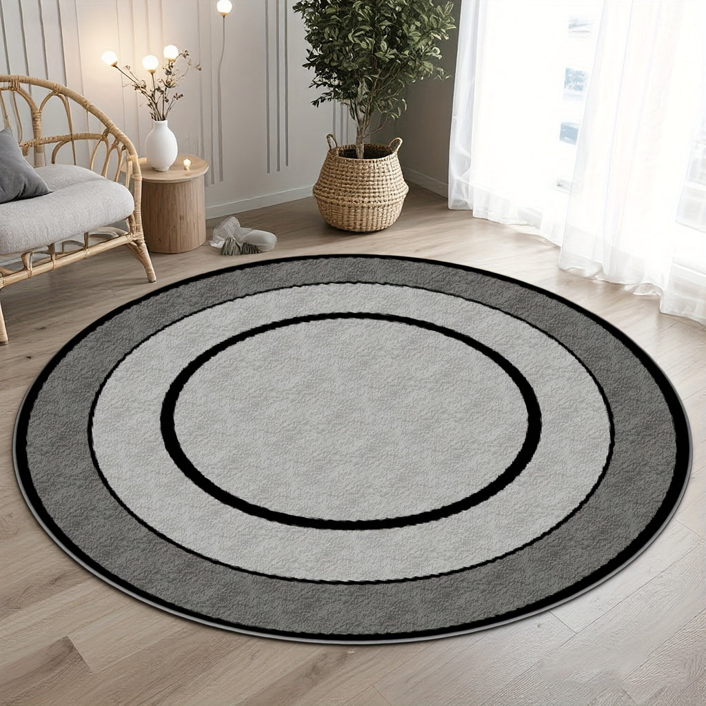 Tapis rond gris à cercles concentriques noirs, fond à pois