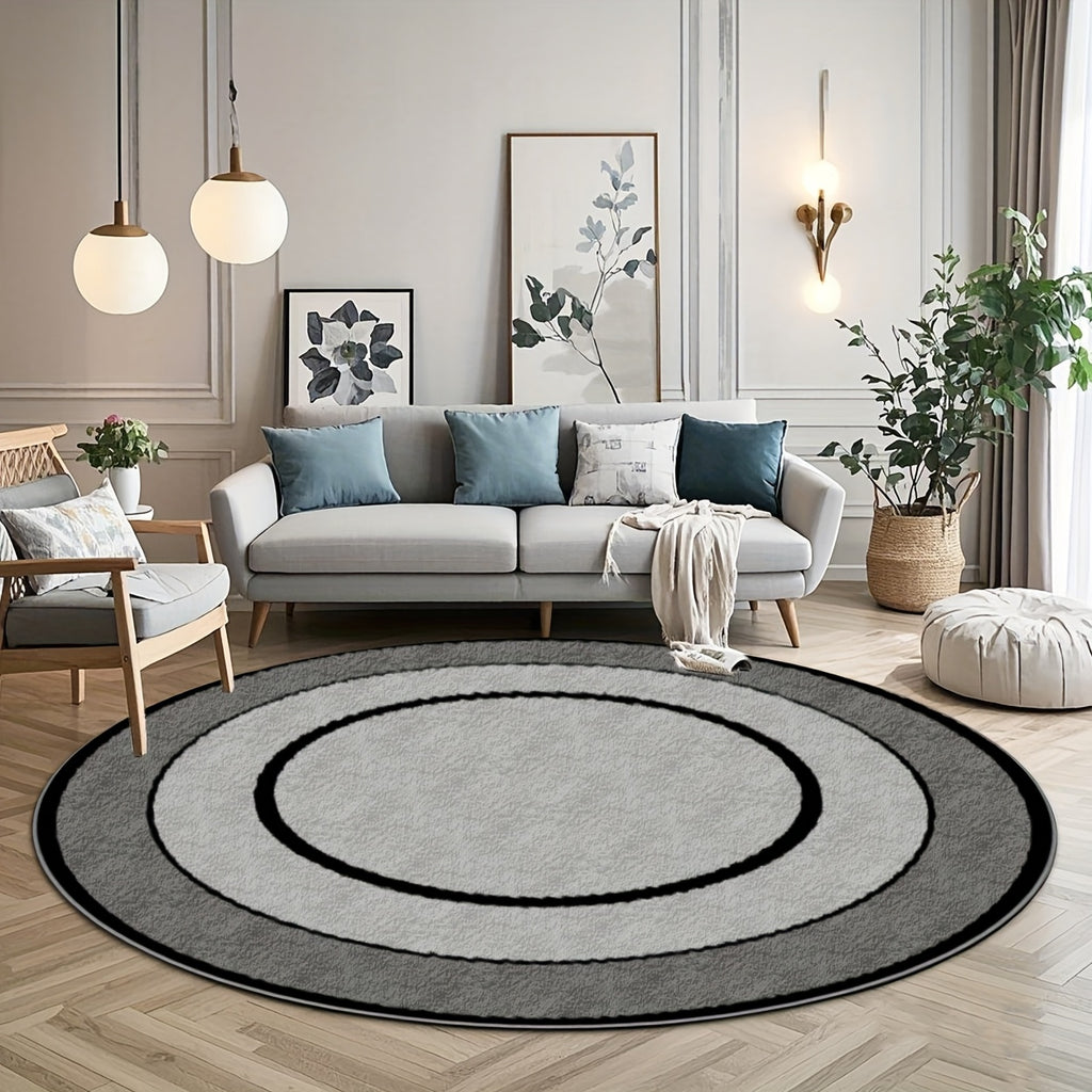 Tapis rond gris à cercles concentriques noirs, fond à pois