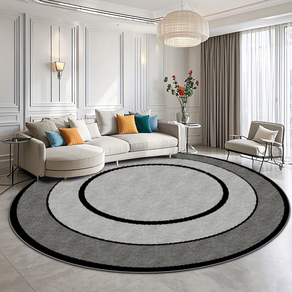 Tapis rond gris à cercles concentriques noirs, fond à pois