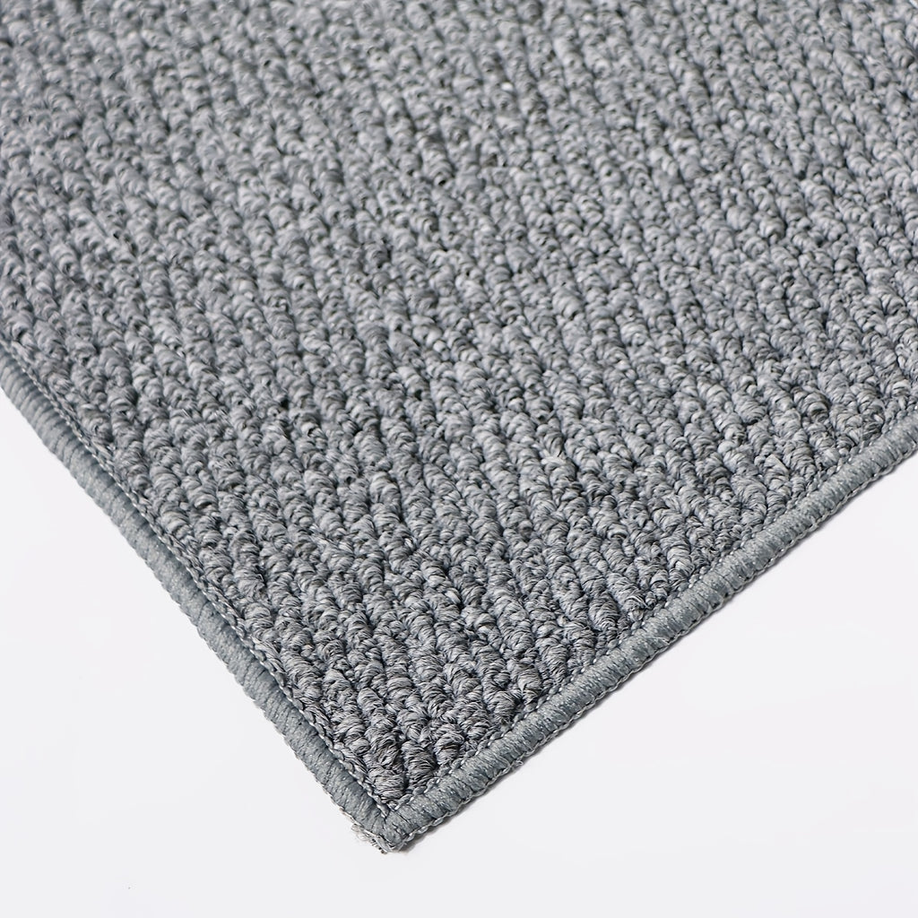 Tapis rond gris en maille bouclée, aspect fibre naturelle