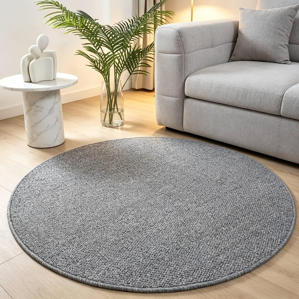 Tapis rond gris en maille bouclée, aspect fibre naturelle