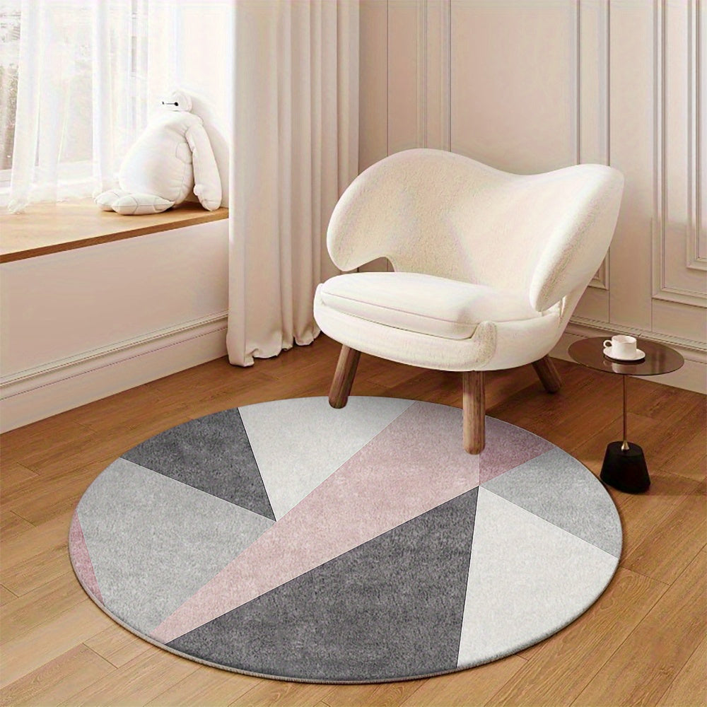 Tapis rond gris et rose à triangles, dos plastique à picots