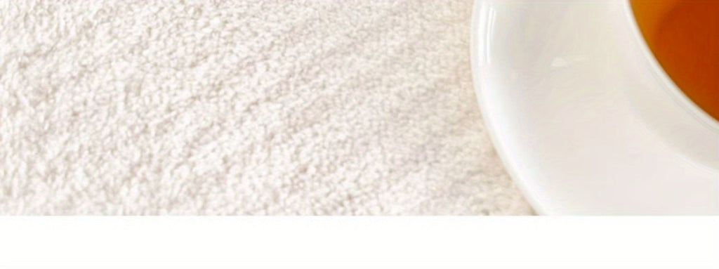 Tapis rond ivoire de forme libre, envers vinyle antidérapant