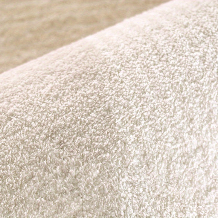 Tapis rond ivoire de forme libre, envers vinyle antidérapant