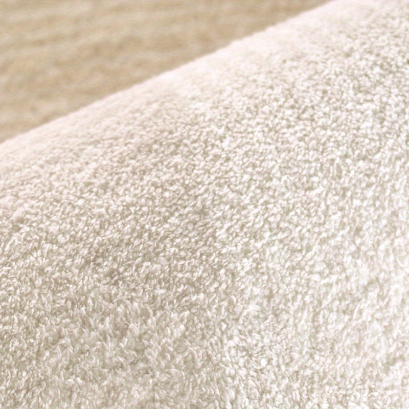 Tapis rond ivoire de forme libre, envers vinyle antidérapant