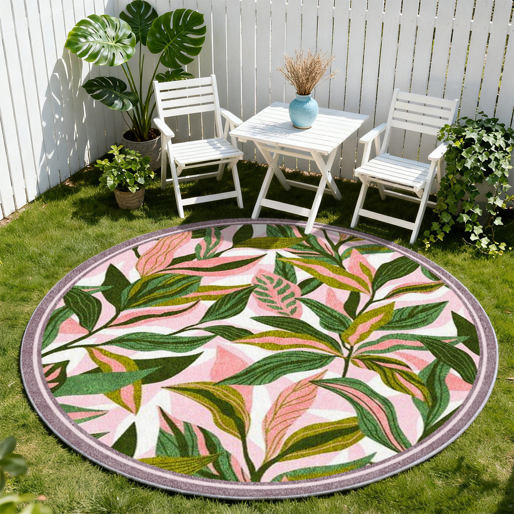 Tapis rond à feuillage vert sur fond rose, bordure mauve