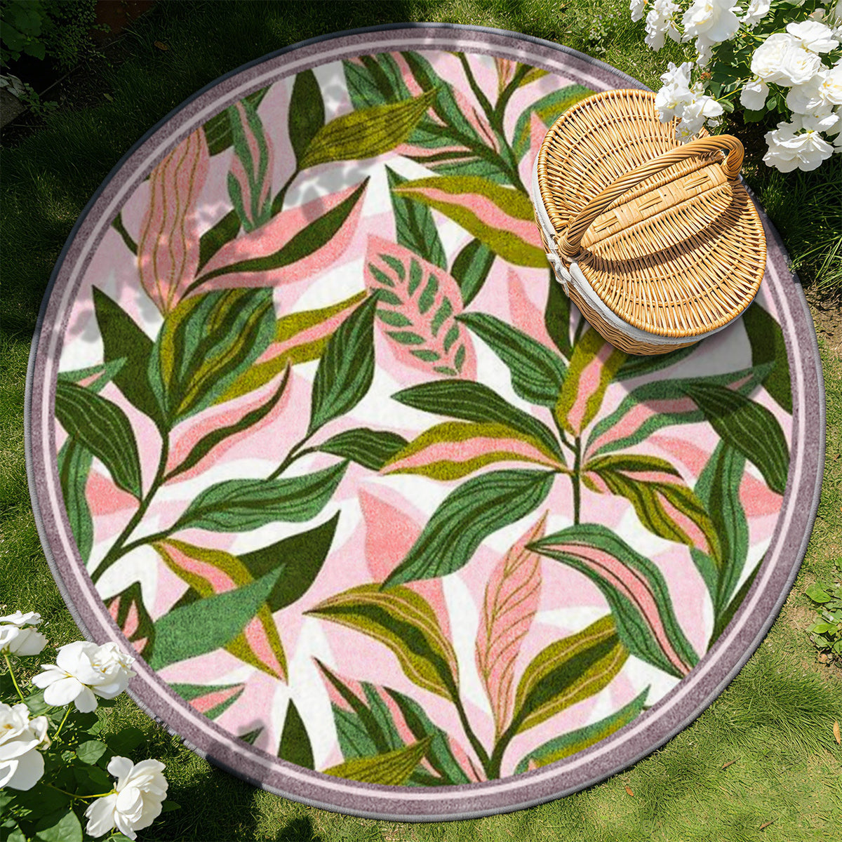 Tapis rond à feuillage vert sur fond rose, bordure mauve