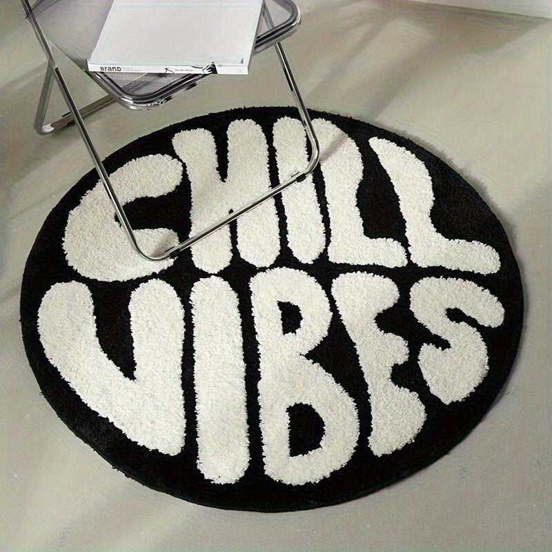 Tapis rond noir et blanc à lettrage tufté en relief, Ø 60 cm