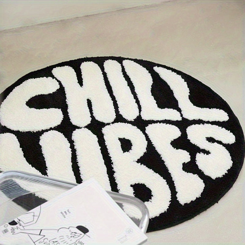 Tapis rond noir et blanc à lettrage tufté en relief, Ø 60 cm