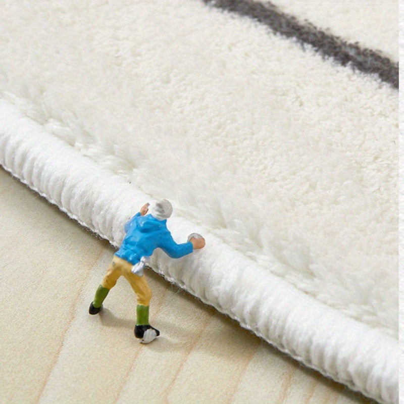 Tapis rond noir et blanc à lettrage tufté en relief, Ø 60 cm