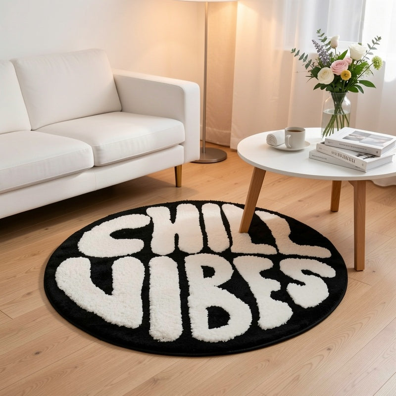 Tapis rond noir et blanc à lettrage tufté en relief, Ø 60 cm
