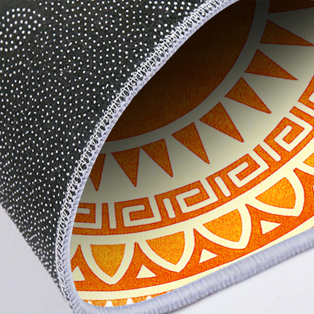 Tapis rond crème à motif soleil orange, bordure à grecque