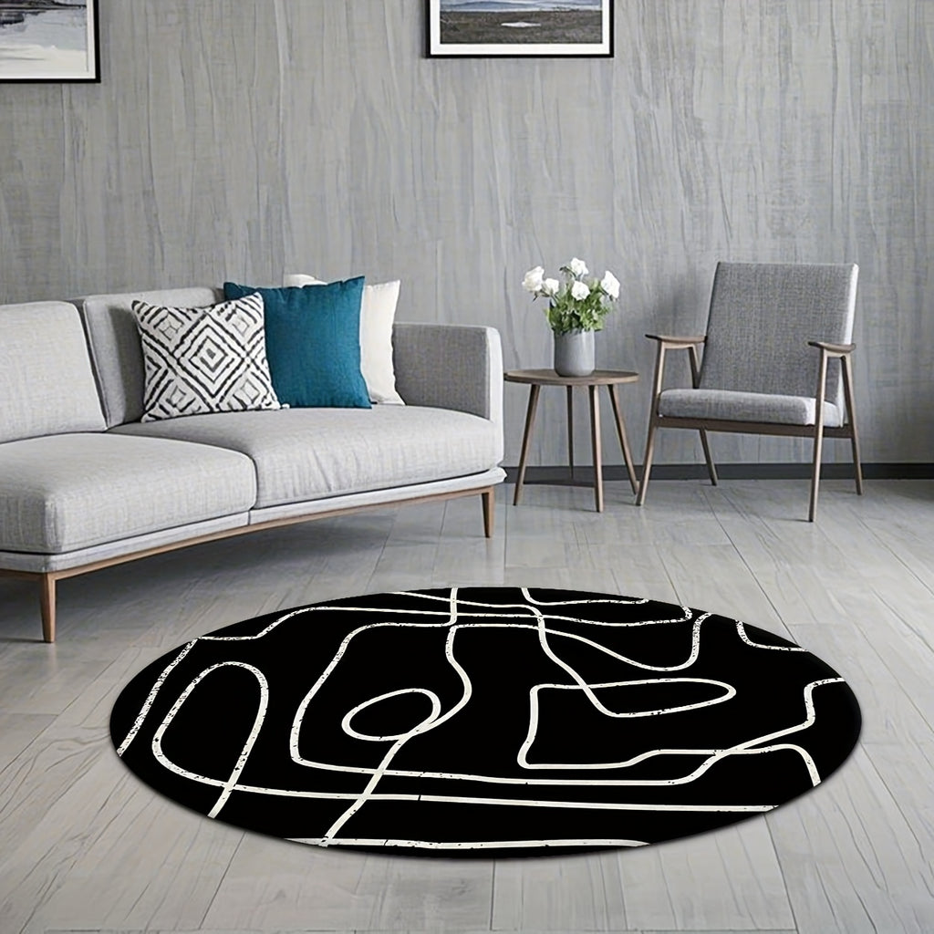 Tapis rond noir à grandes lignes blanches au pinceau sec