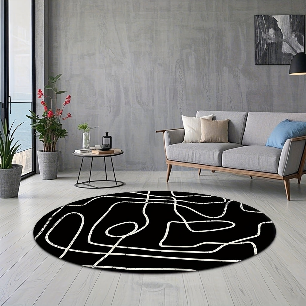 Tapis rond noir à grandes lignes blanches au pinceau sec