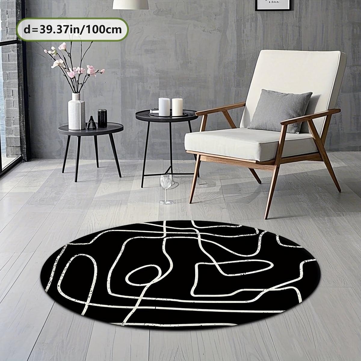 Tapis rond noir à grandes lignes blanches au pinceau sec