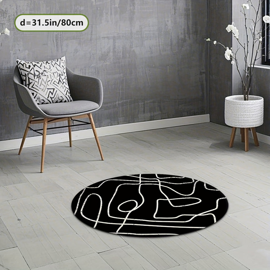 Tapis rond noir à grandes lignes blanches au pinceau sec