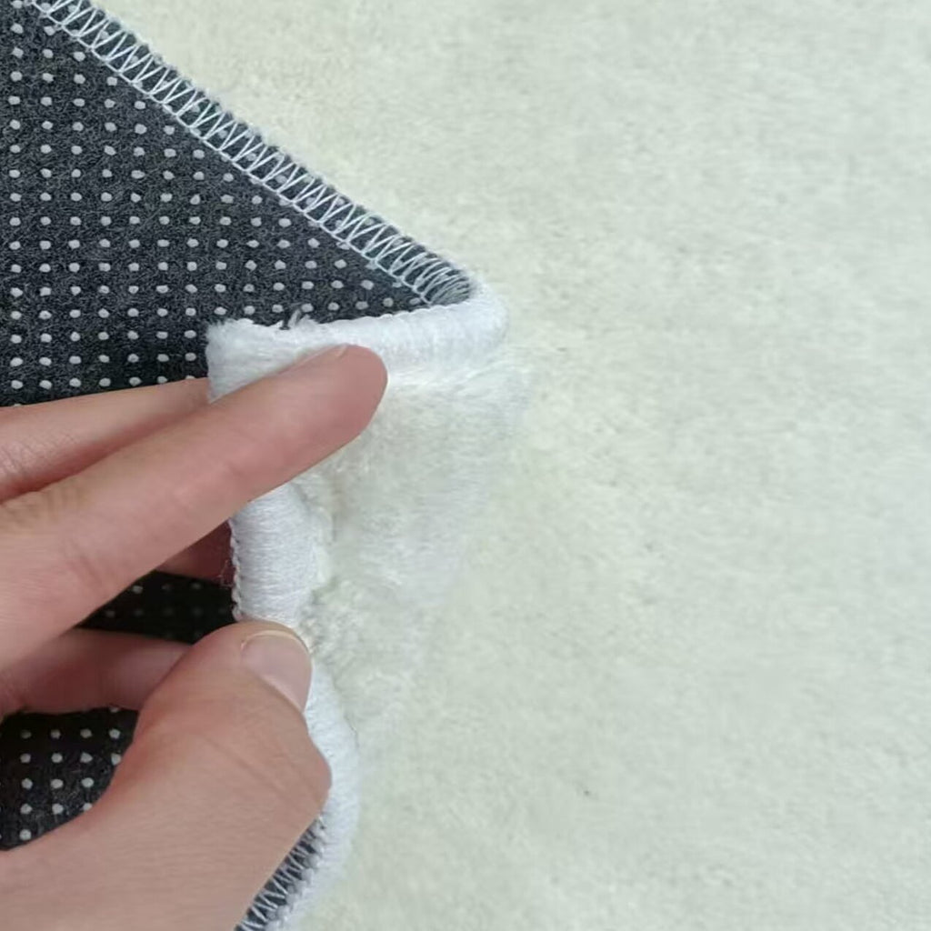 Tapis rond à rayures obliques noires et blanches, Ø 180 cm