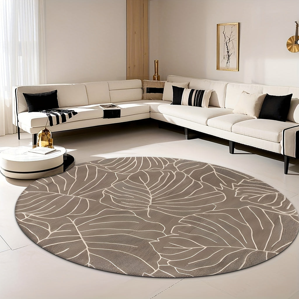 Tapis rond taupe aux grandes feuilles de monstera crème
